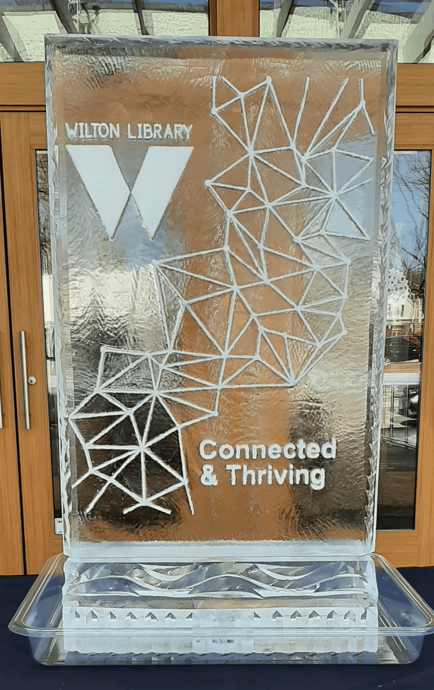 Modern geometric mosaic abstract pattern ice carving with letter W initial