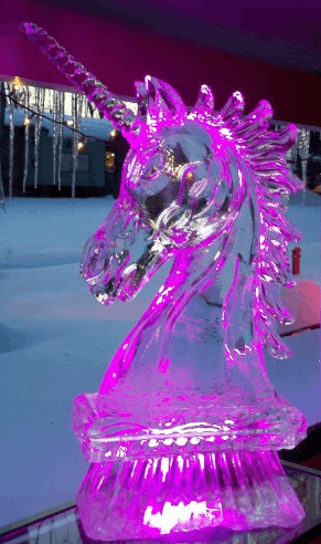 Purple illuminated horse head ice sculpture