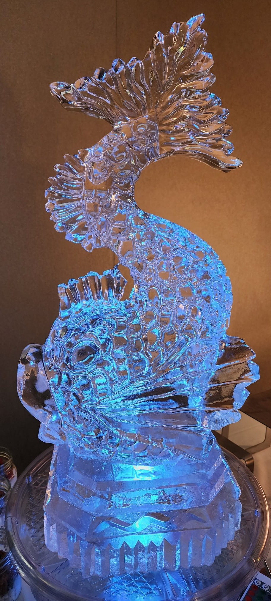 Blue-lit seahorse ice sculpture