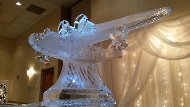 Elegant dynamic abstract soaring bird ice sculpture for a banquet reception