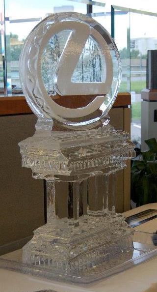 Ornate circular laurel wreath ice sculpture pedestal on display