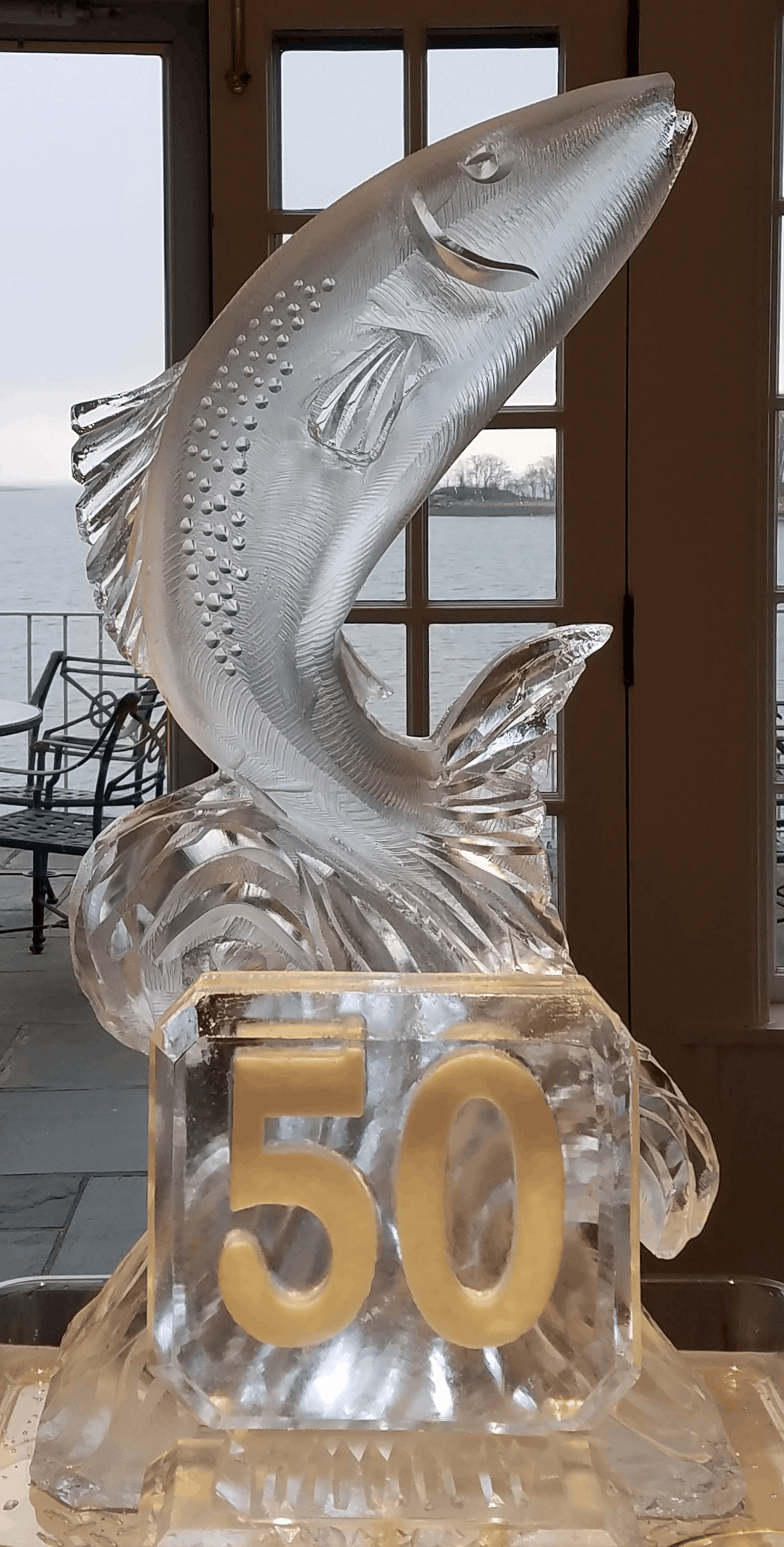Dolphin-themed carved ice sculpture