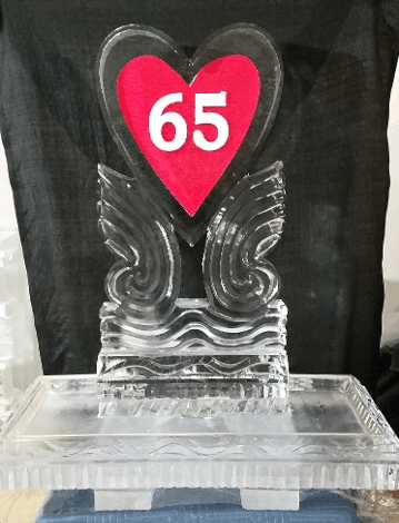 65 milestone ice sculpture with decorative wings