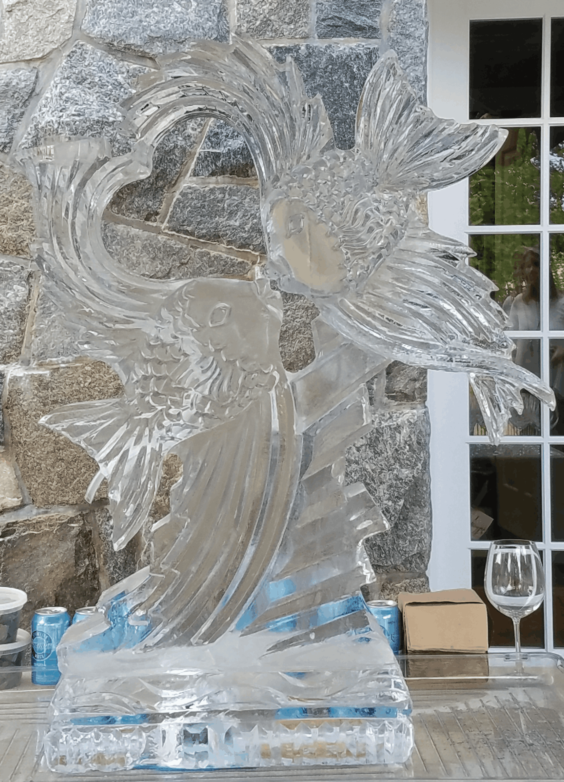 Abstract wave-shaped ice sculpture with blue accent lighting