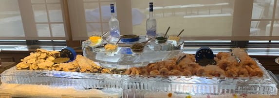Chilled seafood platter on carved ice display