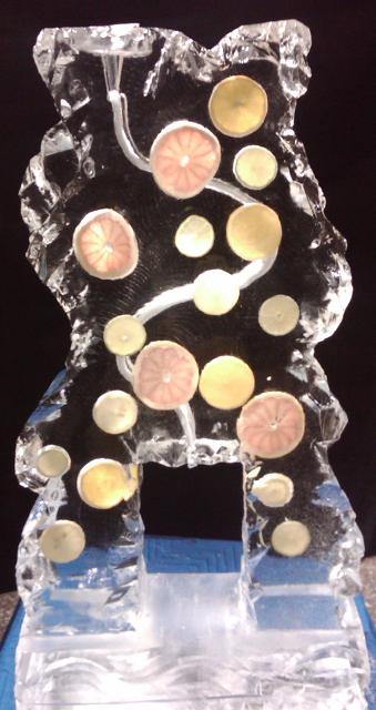 Ice sculpture with embedded citrus fruit slices