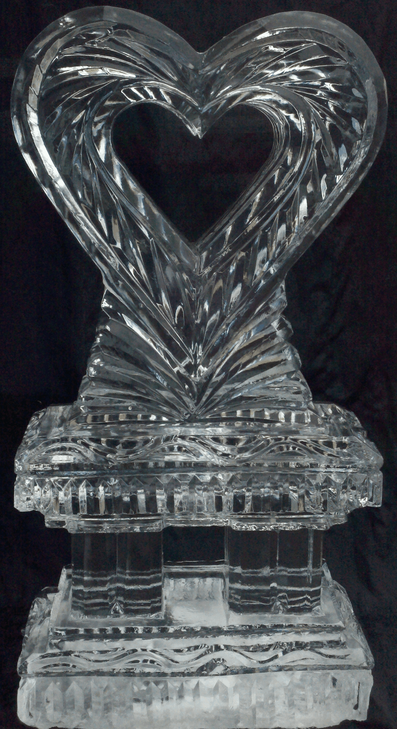 Detailed ice carving of swan wings with sharp clean feather textures