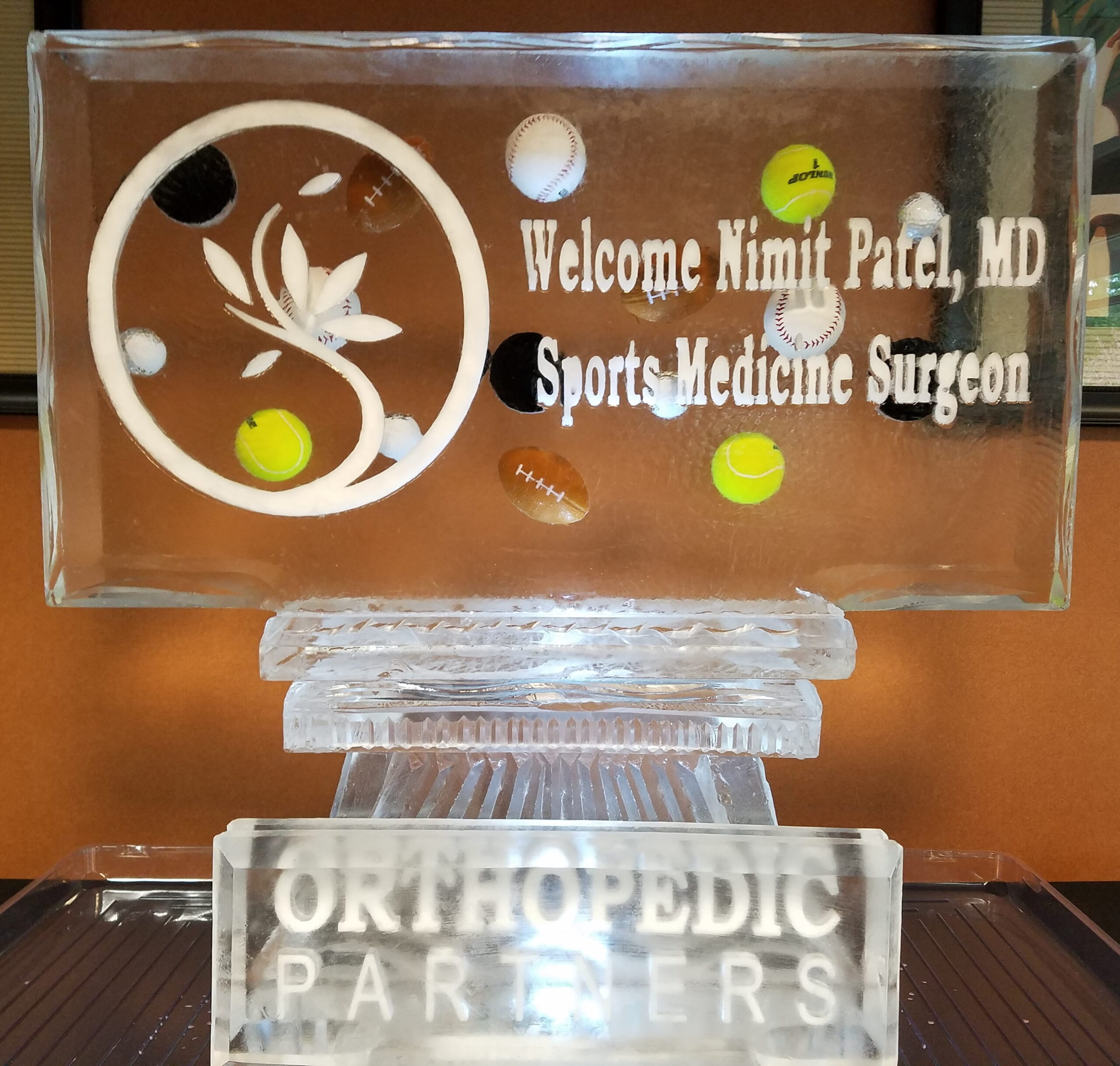 Sports medicine and orthopedics welcoming logo ice block carving
