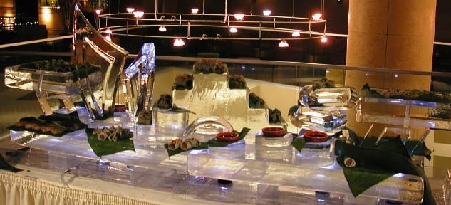 Elegant event buffet with custom ice sculpture centerpiece
