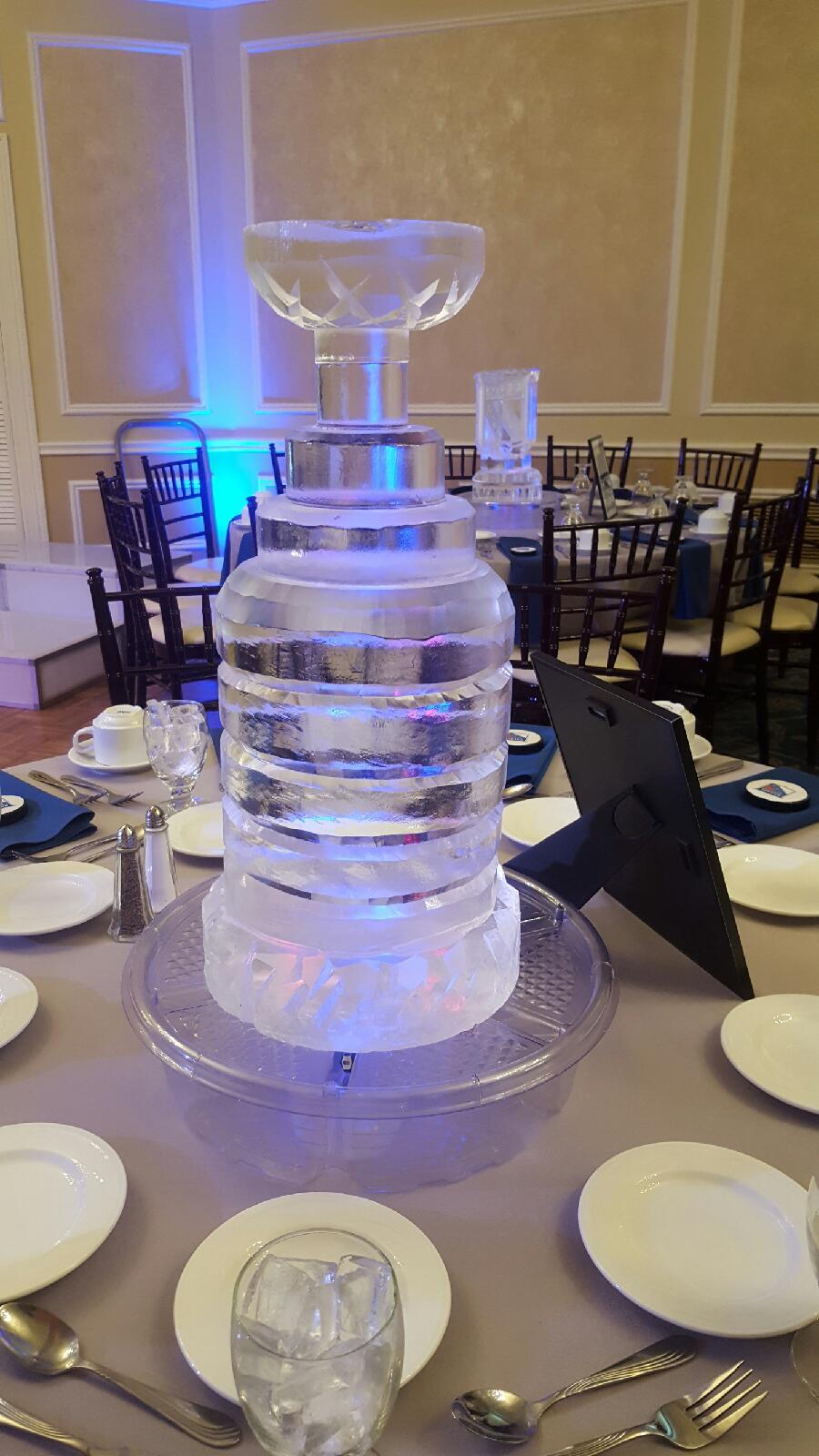 Round tiered ice bar centerpiece with blue lighting