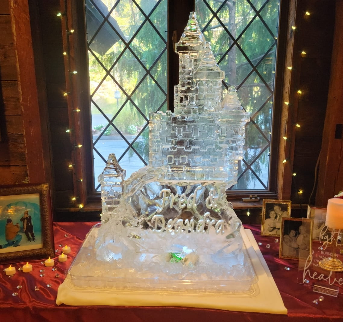 Castle-shaped ice sculpture with detailed architectural carving