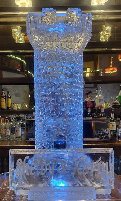 Blue illuminated ice column centerpiece for special events
