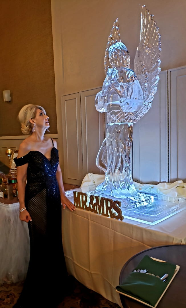 Elegant ice sculpture displayed at an indoor event