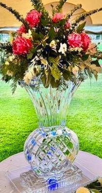 Floral ice vase centerpiece with fresh flower arrangement