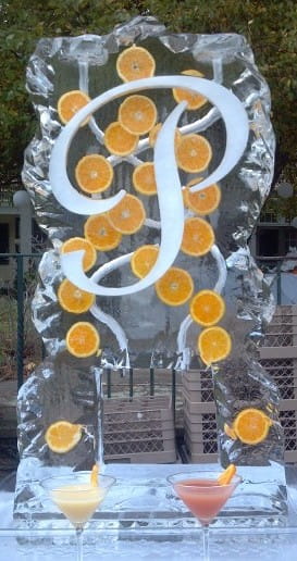 Decorative letter D ice sculpture with orange circular accents
