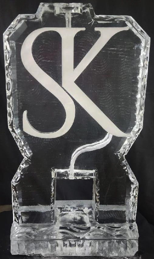 Custom letter K ice sculpture with elegant script design
