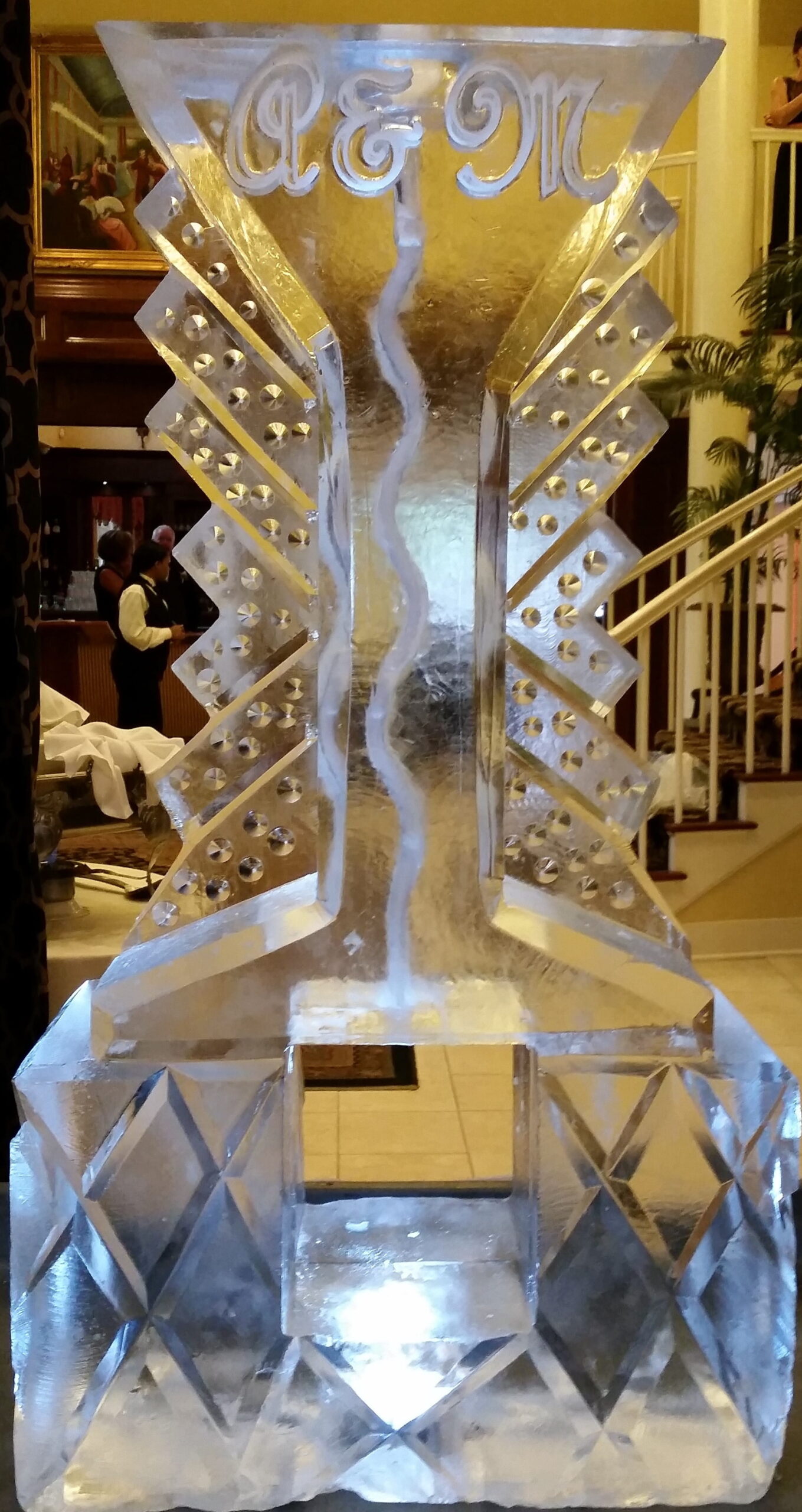 Decorative twisted ice sculpture with illuminated abstract design
