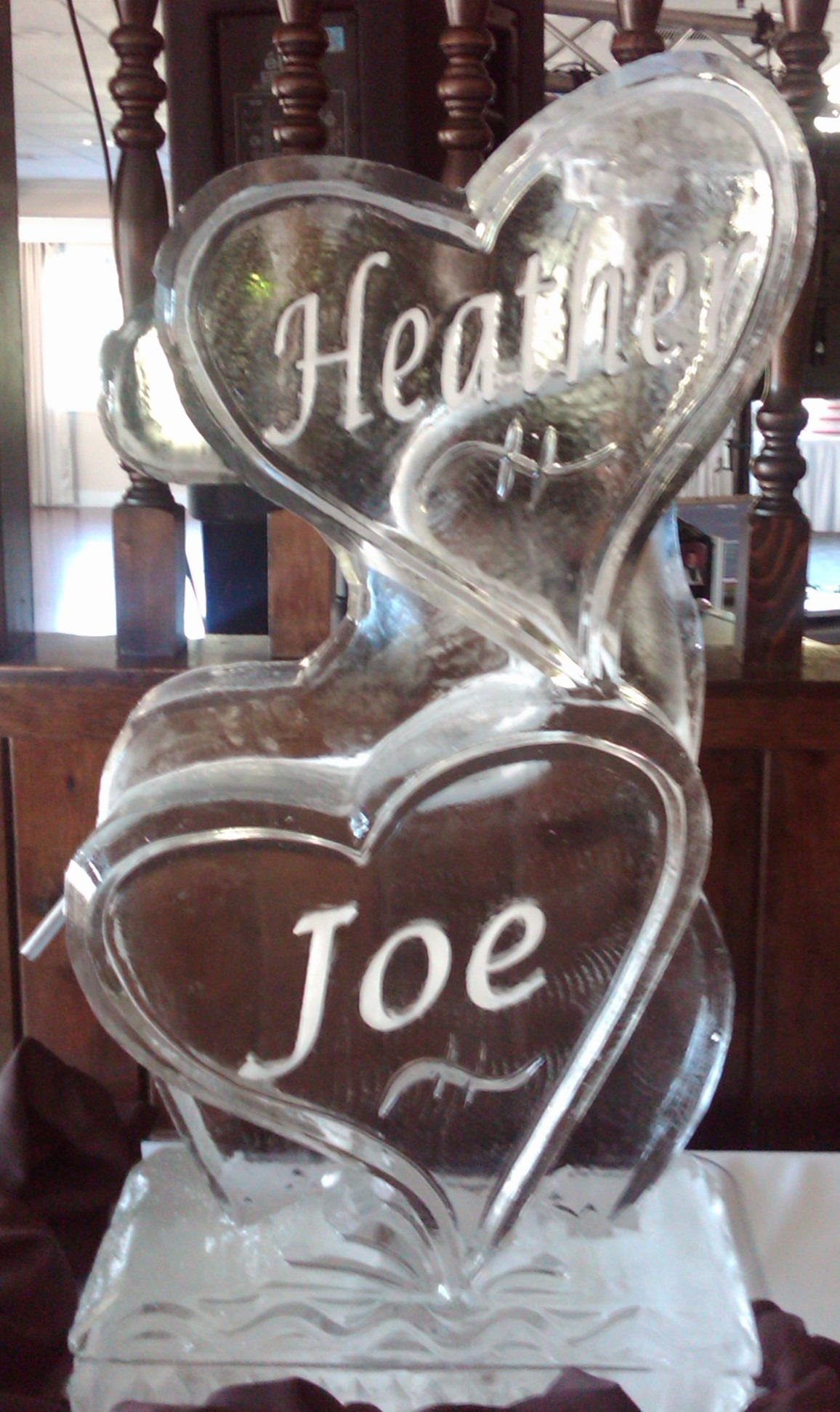 Heart-themed custom ice sculpture for wedding celebration