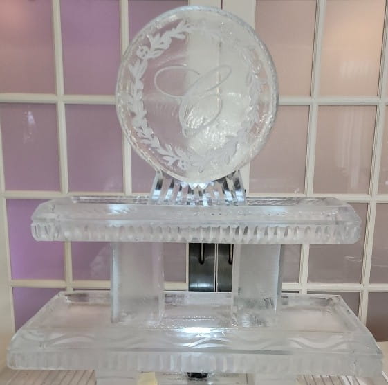 Round monogram ice sculpture with engraved initials for wedding or special event