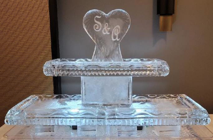 Heart-shaped wedding ice sculpture with personalized initials