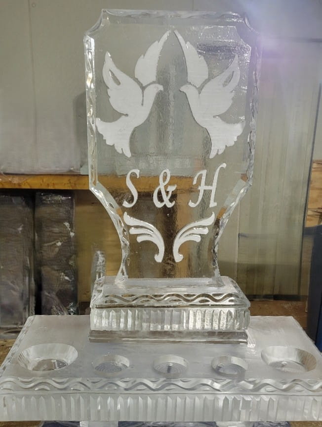 Custom wedding ice sculpture with two doves and S & H monogram