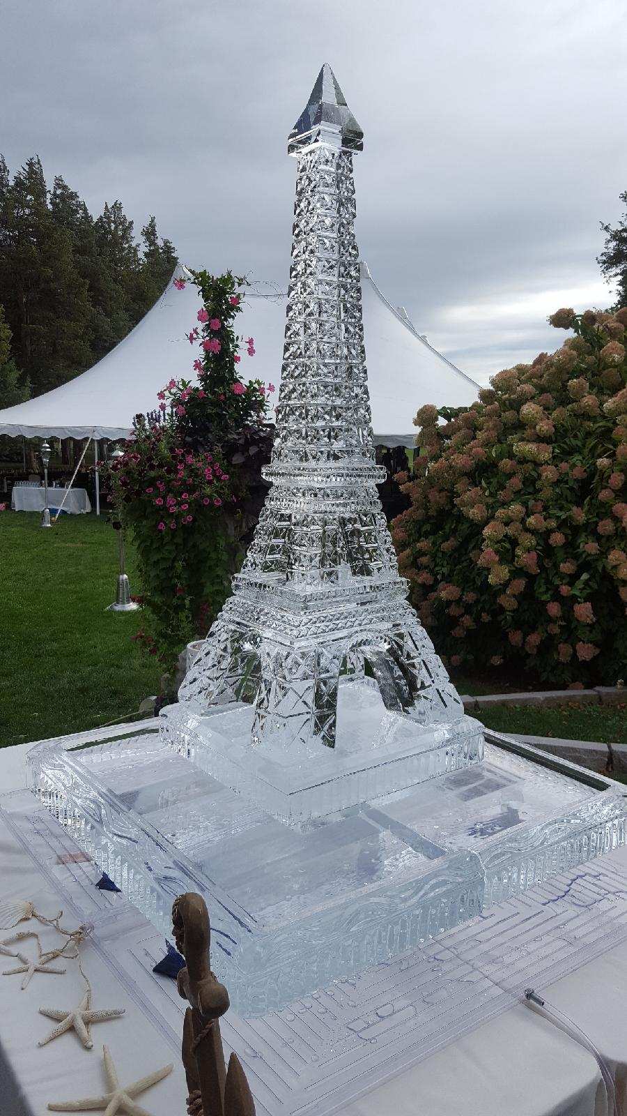 Outdoor ice obelisk sculpture centerpiece