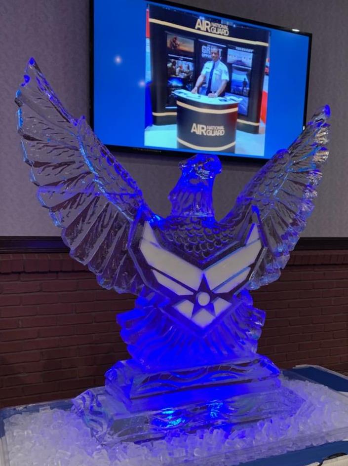 Illuminated angel wings ice sculpture