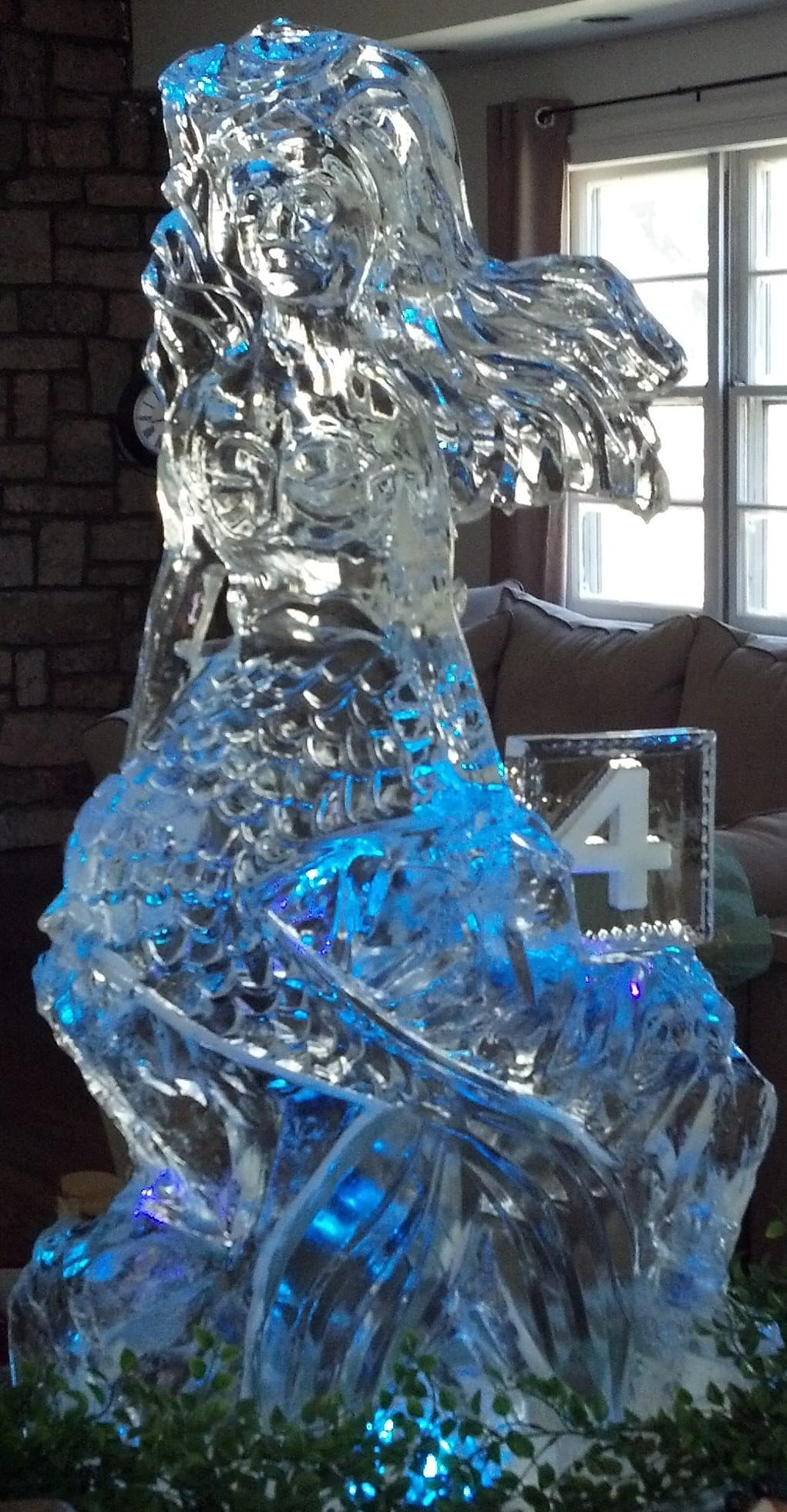 Blue illuminated decorative ice sculpture