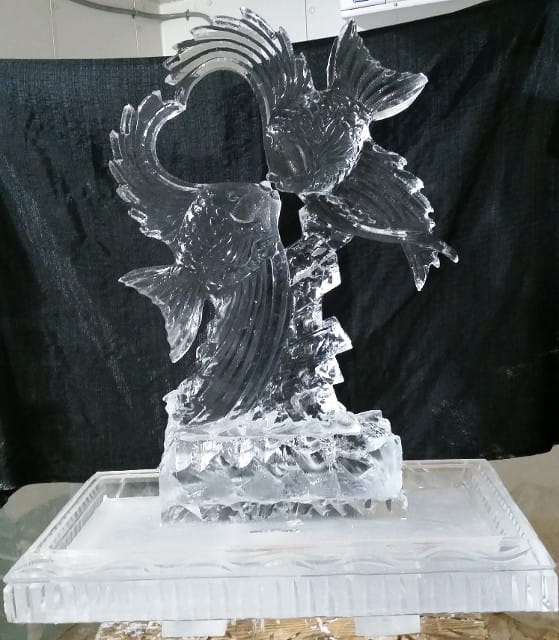 Cupid ice sculpture with heart