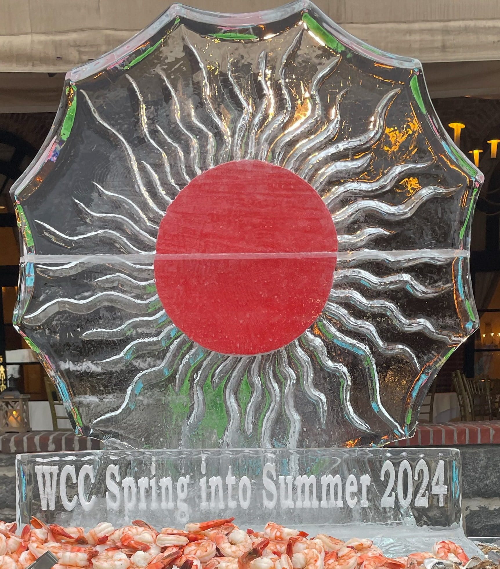 Sunburst ice sculpture with red centerpiece