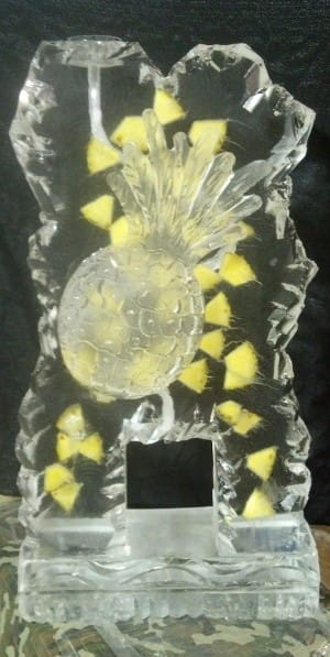 Illuminated pineapple ice sculpture centerpiece
