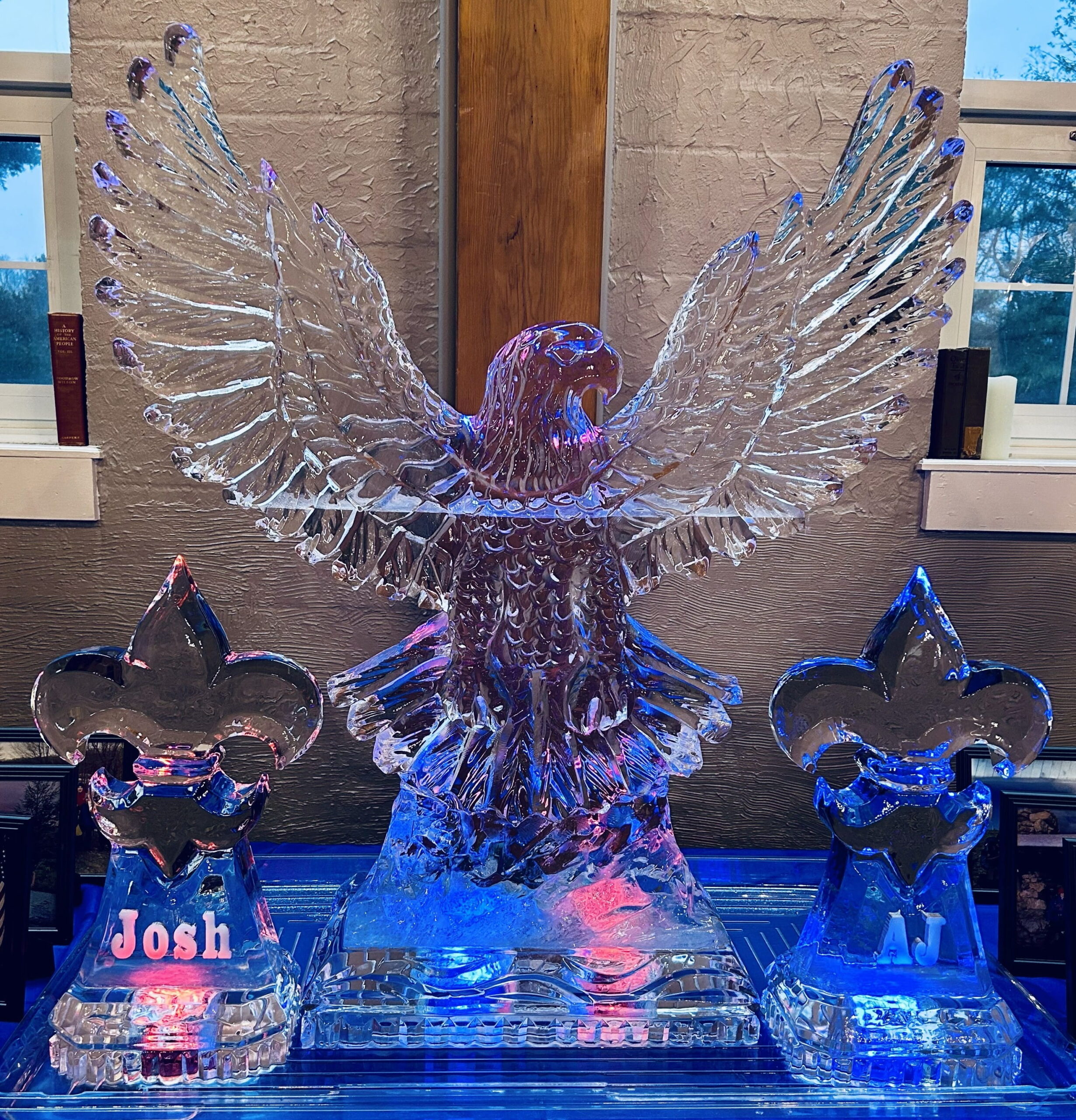Illuminated eagle wings ice sculpture