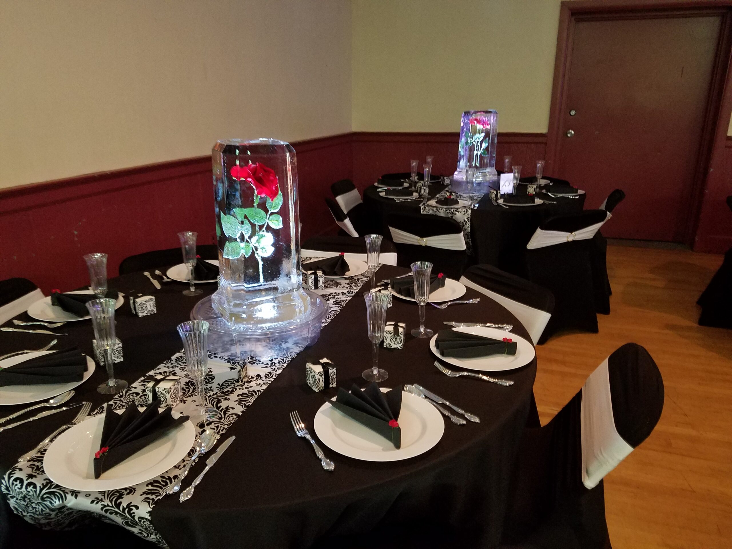 Ice sculpture centerpiece with floral arrangement