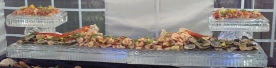 Chilled seafood display on carved ice serving station