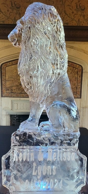 Owl ice sculpture perched on a branch