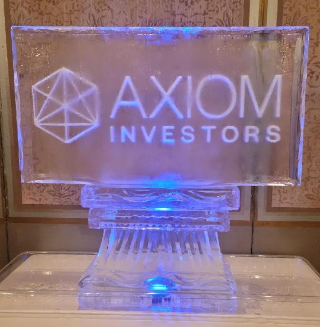 Axiom Investors corporate logo ice sculpture illuminated with blue light