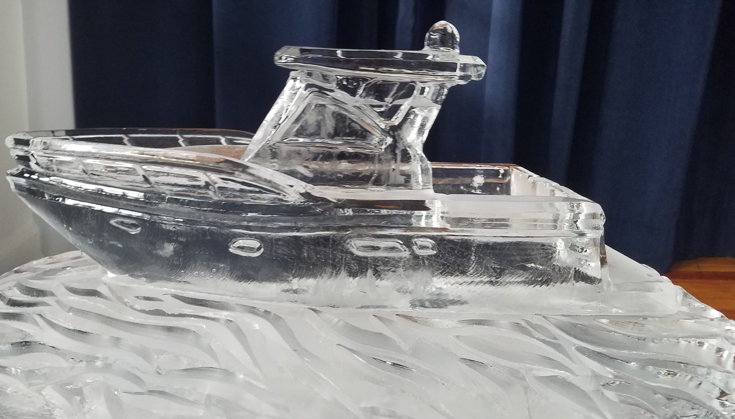Detailed ice sculpture featuring angelic wings or feathers
