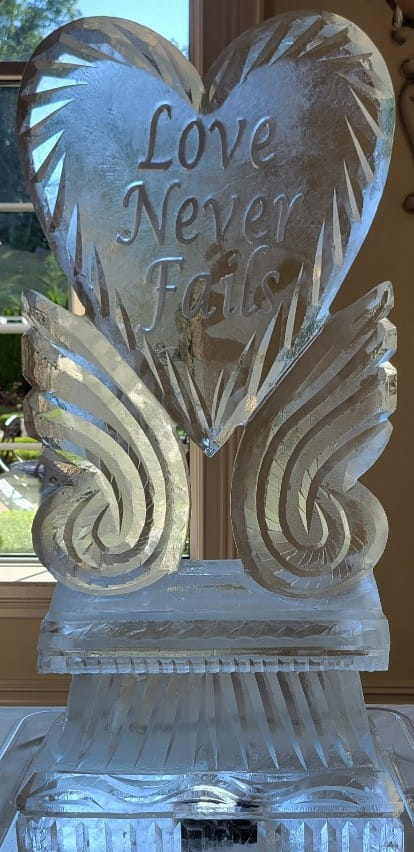 Detailed ice sculpture featuring angelic wings or feathers