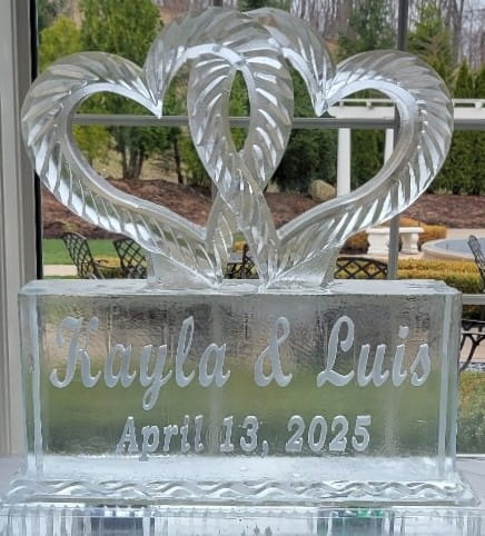 Jayla and Luis custom engraved double swan ice carving