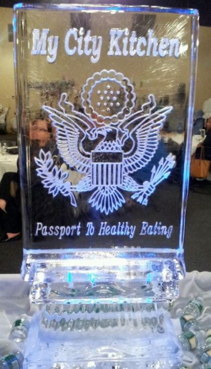Custom crest ice carving featuring patriotic eagle and anchor detailing
