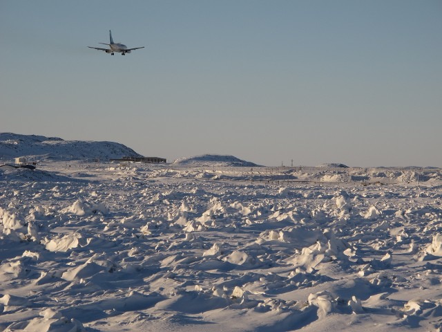 Wide open arctic tundra snowy landscape view under a clear crisp sky
