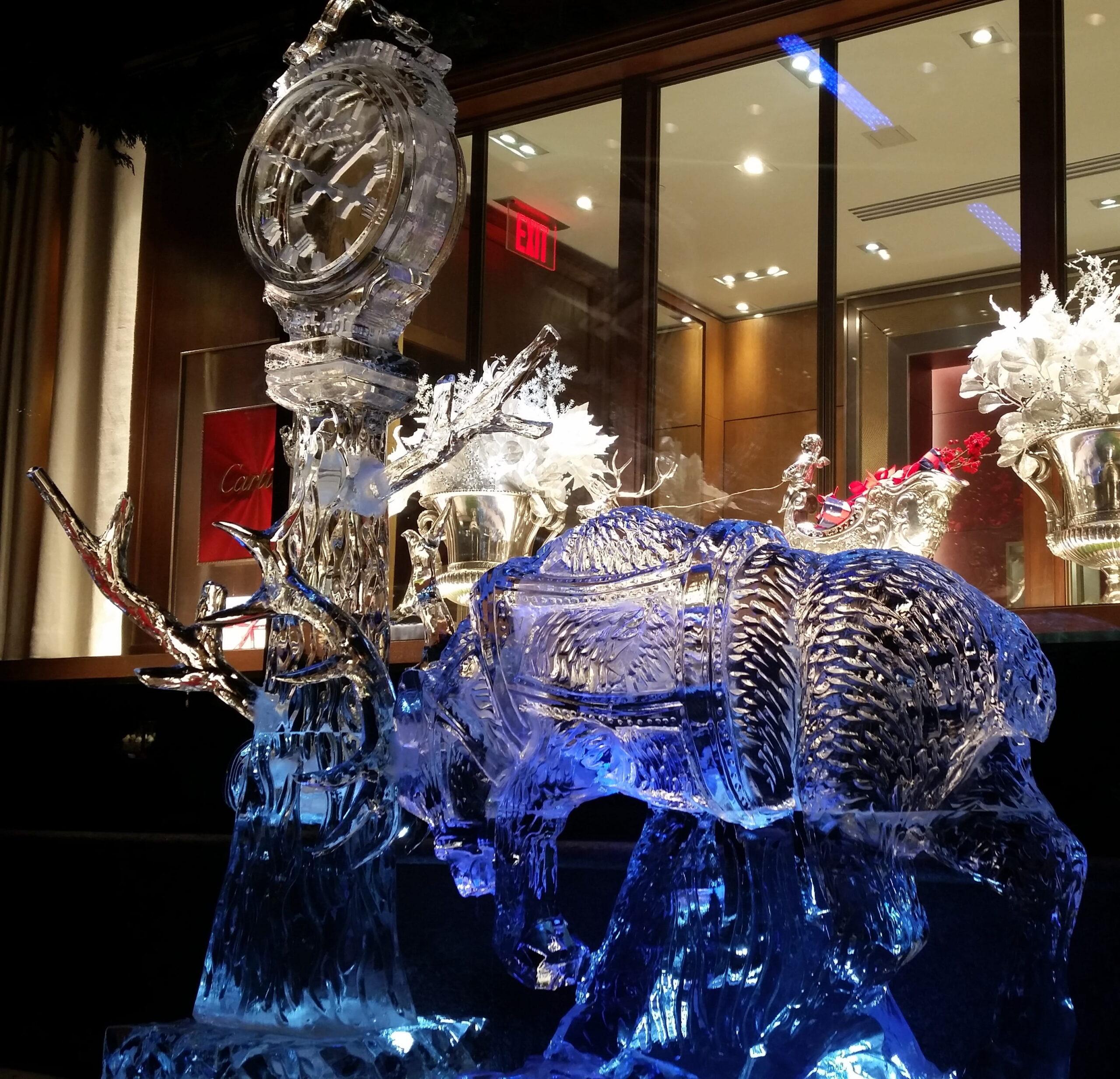 Illuminated ice sculpture display at indoor event