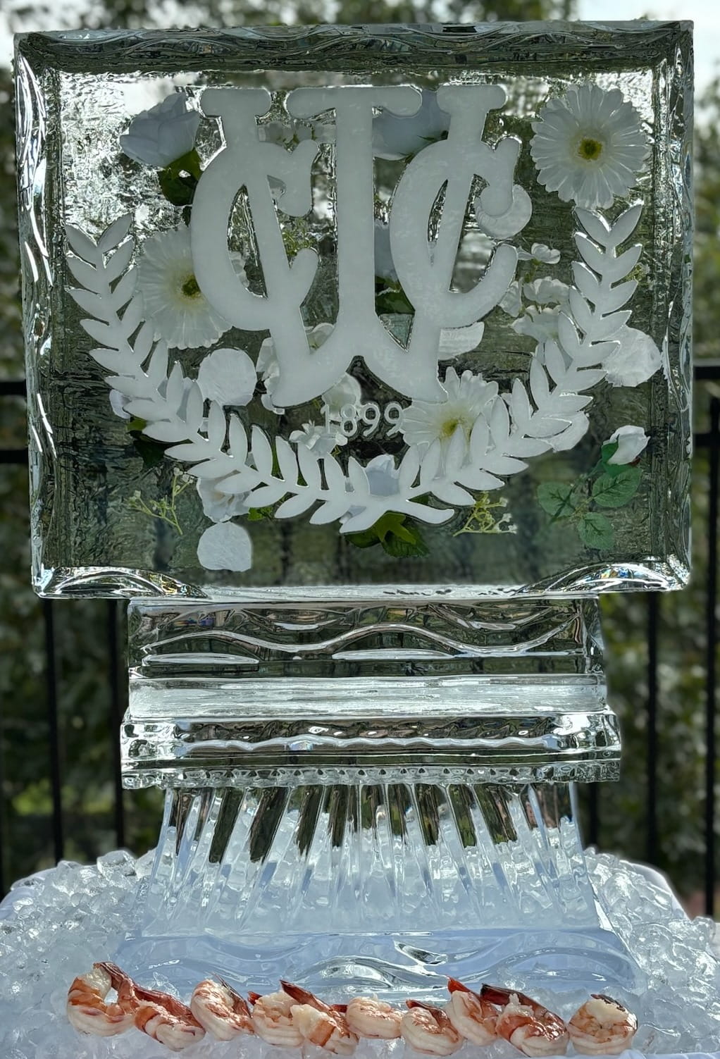 Intricate custom floral crest ice sculpture block for an elegant event
