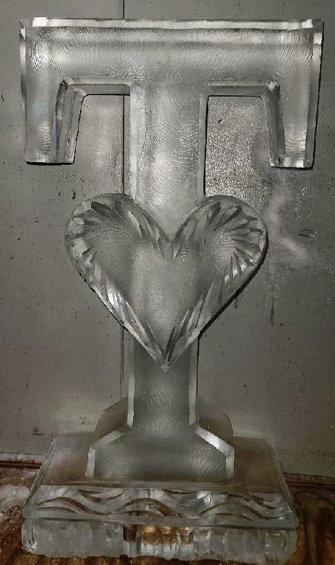 Classic single heart clear ice sculpture for romantic celebrations