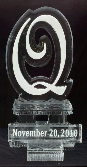 Elegant cursive letter Q clear ice carving