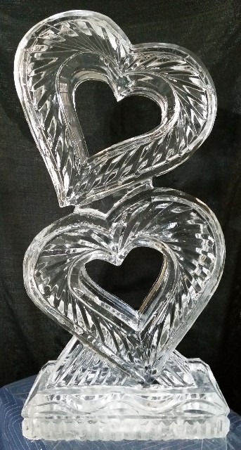 Heart-shaped ice sculpture with intertwined design