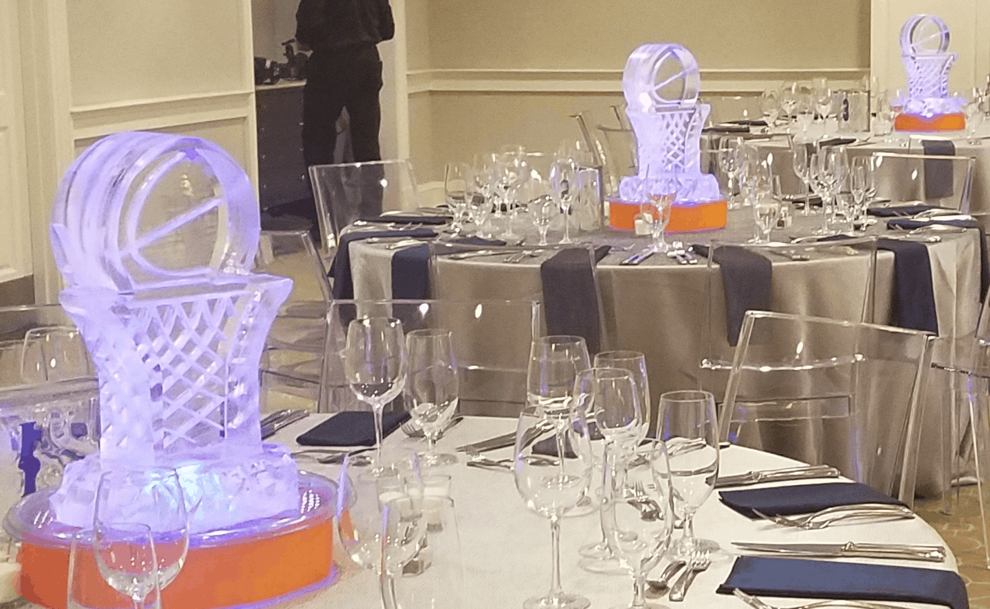 Elegant ice bar display with decorative ice sculpture