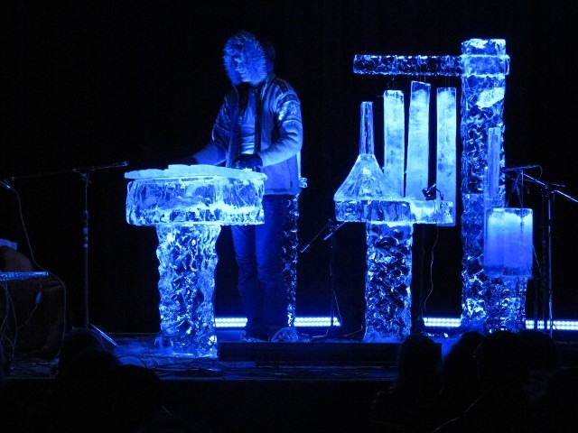 Detailed multi tiered corporate logo ice bar illuminated in brilliant blue