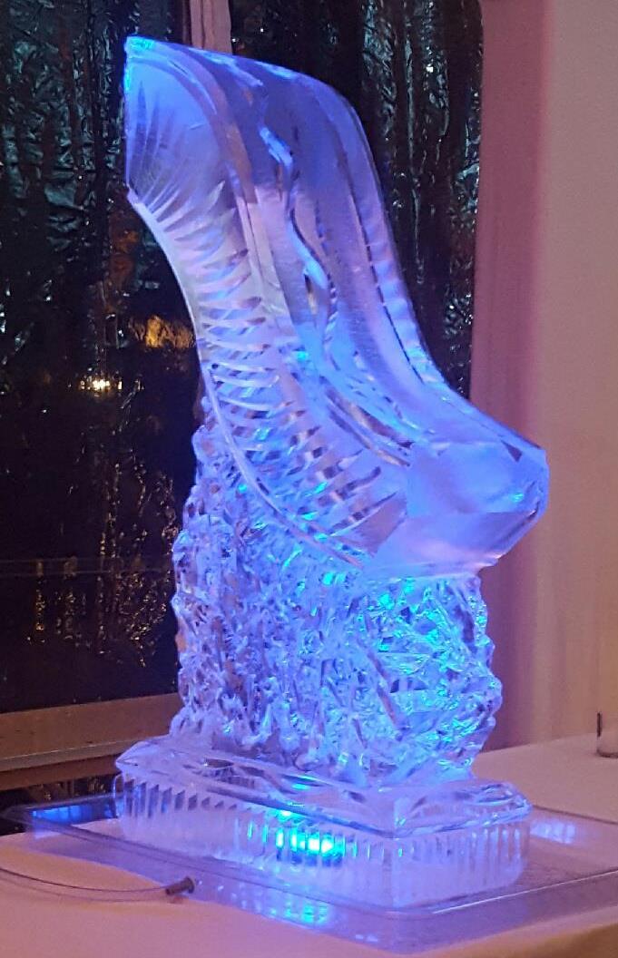Detailed high gloss fluid wave abstract sculpture casting deep blue reflections