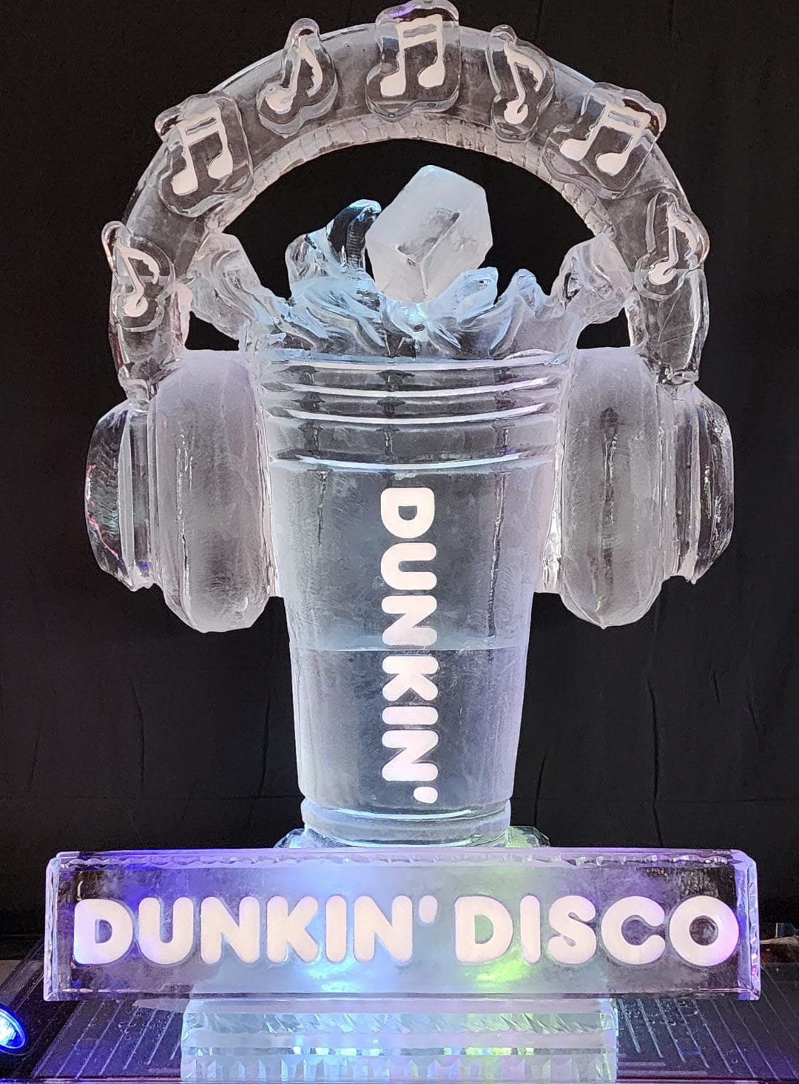 Dunkin Donuts iced coffee cup ice carving featuring large stereo headphones